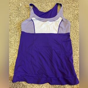 Tank is Lululemon. Has no built in bra and has an adjustable scrunch at bottom